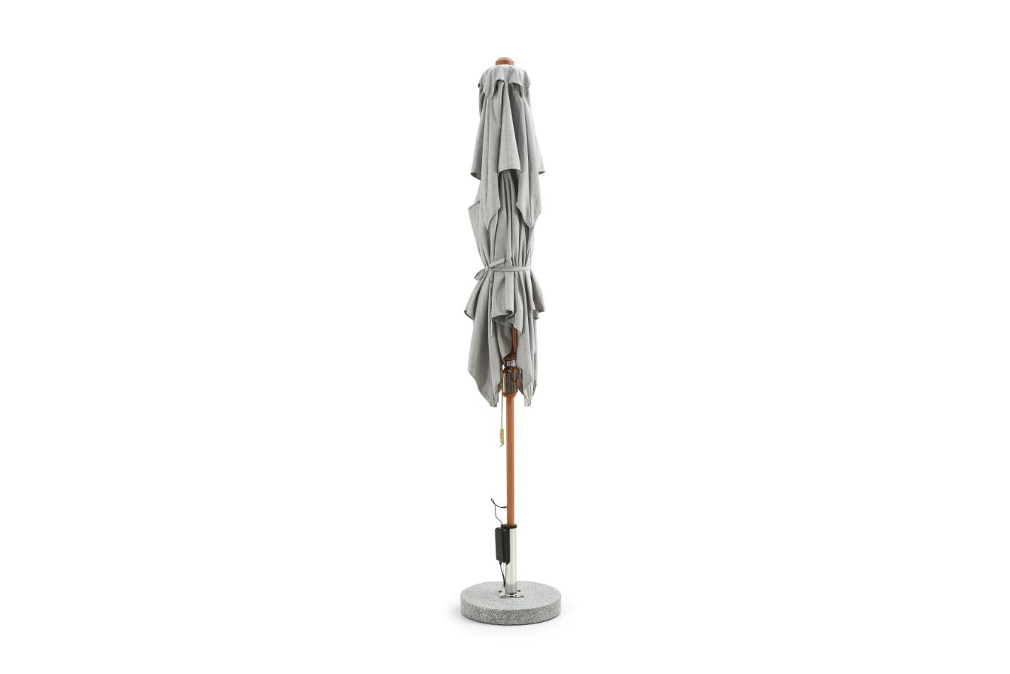 Alizé Barbados 7.5ft square market umbrella closed showing compact folded profile on wood grain pole and standard base