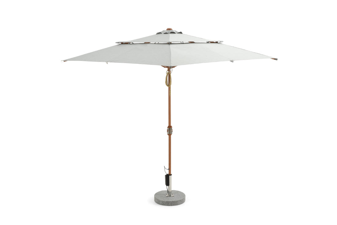 Alizé Barbados 7.5ft square market umbrella with built-in fans and wood grain pole on standard base white background