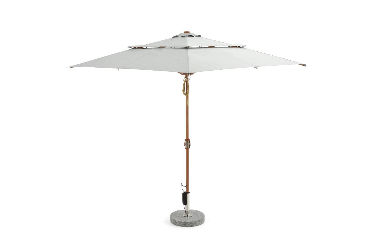 Alizé Barbados 7.5ft square market umbrella with built-in fans and wood grain pole on standard base white background